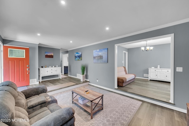 512 Highland Ter, Brick, NJ 08723 - living area with wood finished floors, a chandelier, ornamental molding, baseboards, and recessed lighting