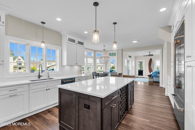 333 Barkentine Ln, Mantoloking, NJ 08738 - kitchen featuring a sink, dark wood-style flooring, light countertops, white cabinets, and glass insert cabinets