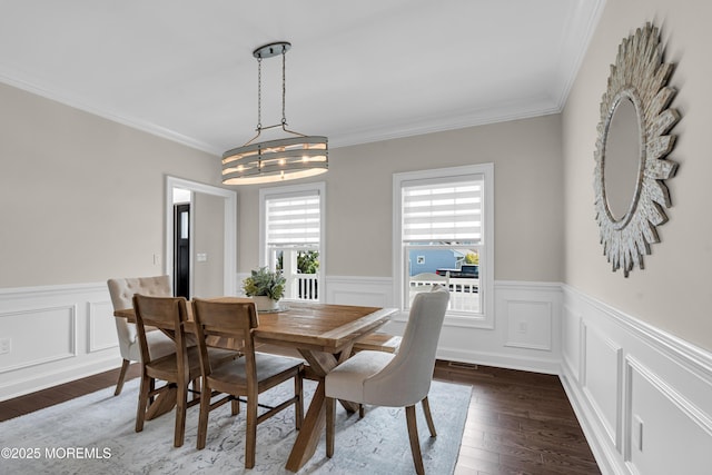 333 Barkentine Ln, Mantoloking, NJ 08738 - dining space with dark wood finished floors, a wainscoted wall, crown molding, a decorative wall, and a chandelier