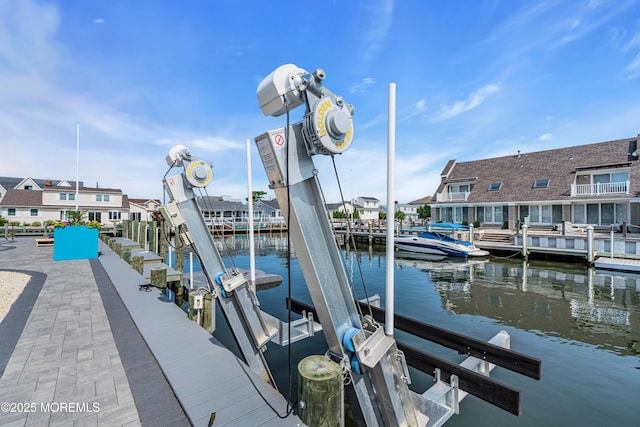 333 Barkentine Ln, Mantoloking, NJ 08738 - dock area with boat lift, a water view, and a residential view