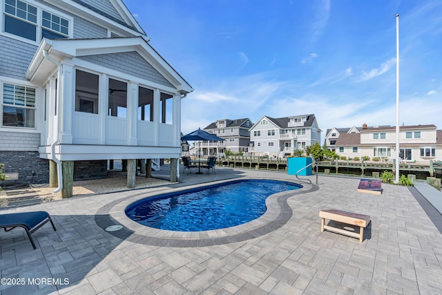 333 Barkentine Ln, Mantoloking, NJ 08738 - view of swimming pool with a residential view, a patio area, and a sunroom