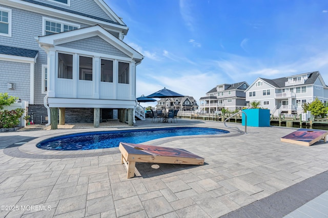 333 Barkentine Ln, Mantoloking, NJ 08738 - swimming pool with a residential view, a sunroom, a patio, and stairs