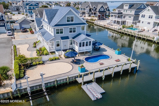 333 Barkentine Ln, Mantoloking, NJ 08738 - aerial perspective of suburban area with a large body of water and a pool