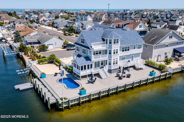 333 Barkentine Ln, Mantoloking, NJ 08738 - aerial perspective of suburban area featuring a large body of water and a pool area