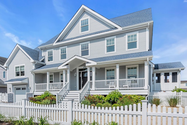 333 Barkentine Ln, Mantoloking, NJ 08738 - view of front facade with covered porch, a shingled roof, and an attached garage