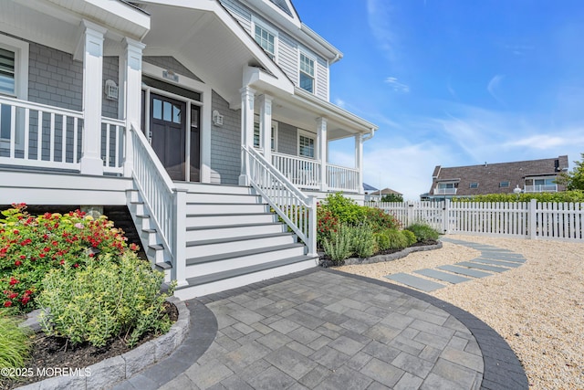 333 Barkentine Ln, Mantoloking, NJ 08738 - view of exterior entry with a porch