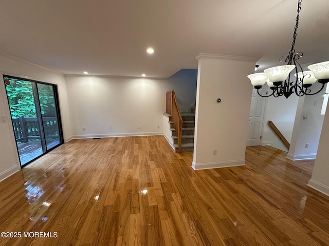 1508 Alpine Trl Unit 1508, Neptune Township, NJ 07753 - unfurnished living room featuring baseboards, stairway, a chandelier, ornamental molding, and light wood finished floors