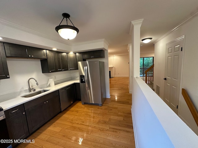 1508 Alpine Trl Unit 1508, Neptune Township, NJ 07753 - kitchen with appliances with stainless steel finishes, a sink, light wood-type flooring, light countertops, and ornamental molding