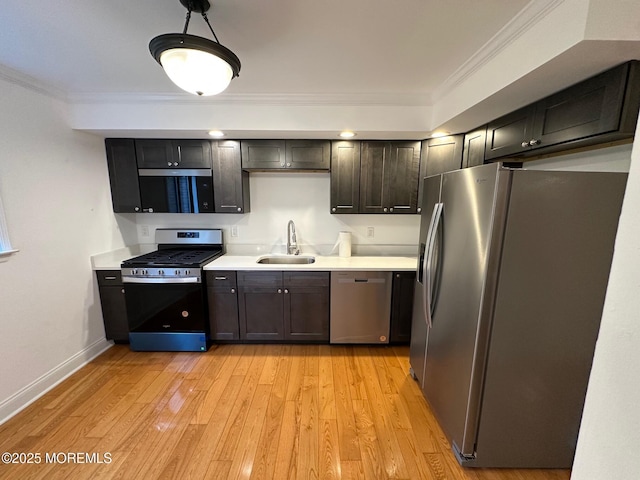 1508 Alpine Trl Unit 1508, Neptune Township, NJ 07753 - kitchen featuring appliances with stainless steel finishes, a sink, light wood-style floors, light countertops, and crown molding