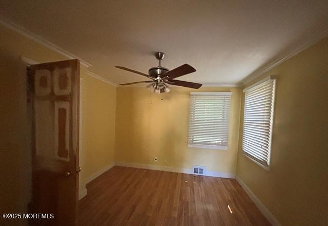 90 Statesir Pl, Red Bank, NJ 07701 - unfurnished room featuring ornamental molding, wood finished floors, baseboards, and a ceiling fan