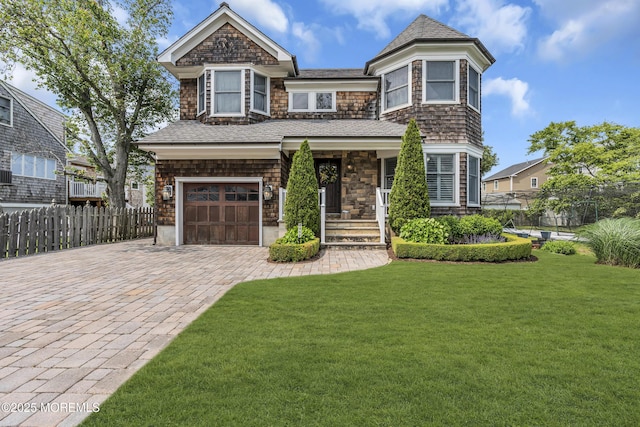 2117 Seagull Ter, Point Pleasant, NJ 08742 - shingle-style home featuring a garage, decorative driveway, and a porch