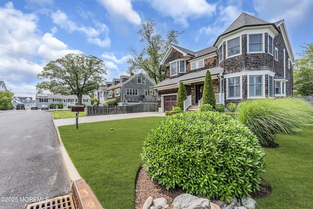 2117 Seagull Ter, Point Pleasant, NJ 08742 - shingle-style home featuring driveway, a garage, a residential view, and a shingled roof