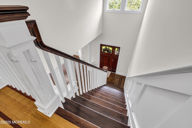 2117 Seagull Ter, Point Pleasant, NJ 08742 - staircase with plenty of natural light, wood finished floors, and a towering ceiling