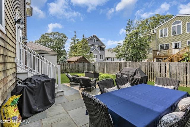 2117 Seagull Ter, Point Pleasant, NJ 08742 - fenced backyard with a patio area, outdoor dining space, a grill, and an outdoor hangout area