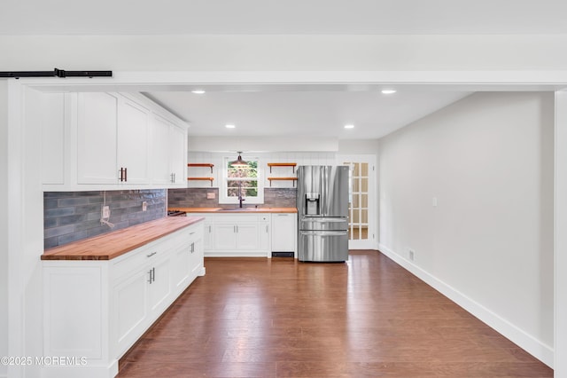 3132 Cohocton Ave, Point Pleasant, NJ 08742 - kitchen with stainless steel fridge, butcher block counters, open shelves, backsplash, and dark wood-style floors