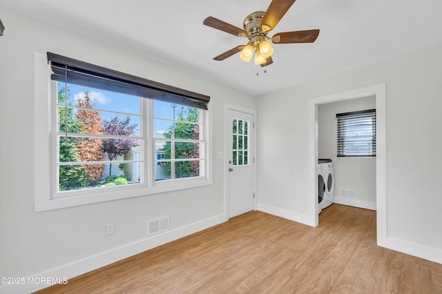 3132 Cohocton Ave, Point Pleasant, NJ 08742 - empty room with washer and dryer, light wood-style floors, baseboards, and plenty of natural light