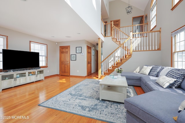 3 Watson Pl, Manasquan, NJ 08736 - living area with wood finished floors, stairs, and a high ceiling