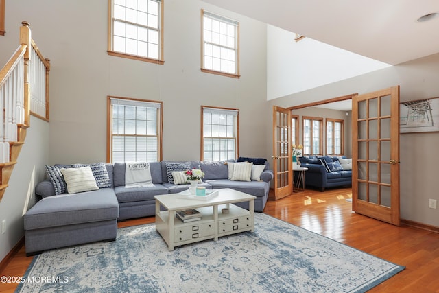 3 Watson Pl, Manasquan, NJ 08736 - living area featuring french doors, healthy amount of natural light, wood finished floors, and a high ceiling