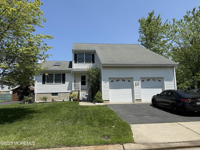 549 Clark Ave, Union Beach, NJ 07735 - traditional-style house with a garage, driveway, and a front yard