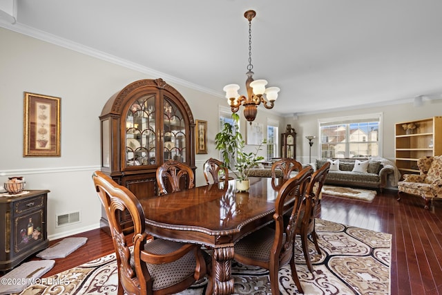 28 Hannah Lee Rd, Barnegat, NJ 08005 - dining area with a chandelier, ornamental molding, and dark wood-type flooring