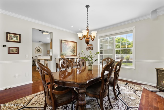 28 Hannah Lee Rd, Barnegat, NJ 08005 - dining room featuring a chandelier, hardwood / wood-style flooring, crown molding, and baseboards