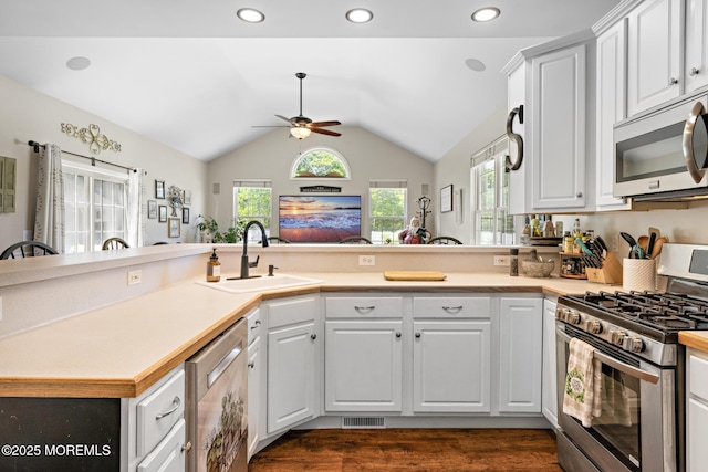 28 Hannah Lee Rd, Barnegat, NJ 08005 - kitchen featuring stainless steel appliances, a sink, lofted ceiling, ceiling fan, and a peninsula