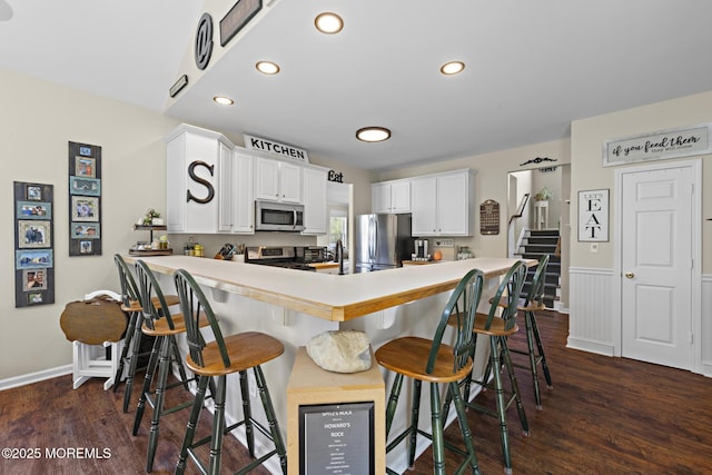 28 Hannah Lee Rd, Barnegat, NJ 08005 - kitchen featuring stainless steel appliances, recessed lighting, light countertops, dark wood finished floors, and a peninsula