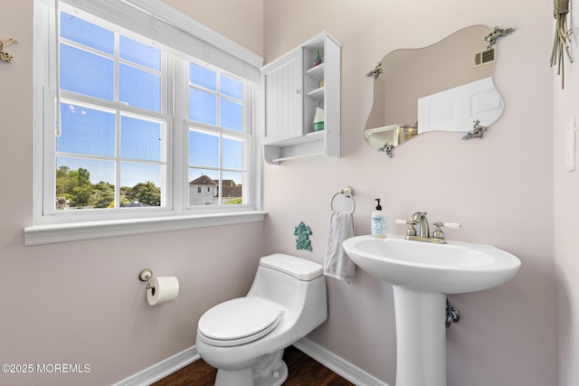 28 Hannah Lee Rd, Barnegat, NJ 08005 - half bathroom with toilet, baseboards, wood finished floors, and a sink