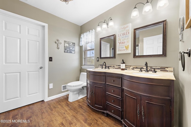 28 Hannah Lee Rd, Barnegat, NJ 08005 - bathroom with double vanity, toilet, wood finished floors, and baseboards