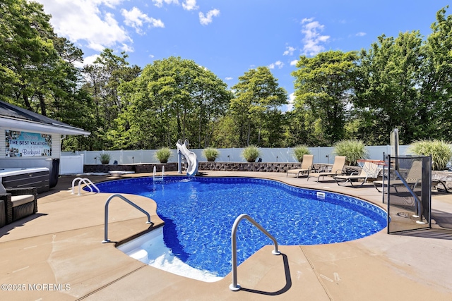 28 Hannah Lee Rd, Barnegat, NJ 08005 - view of swimming pool with a patio, a fenced backyard, view of wooded area, and a water slide