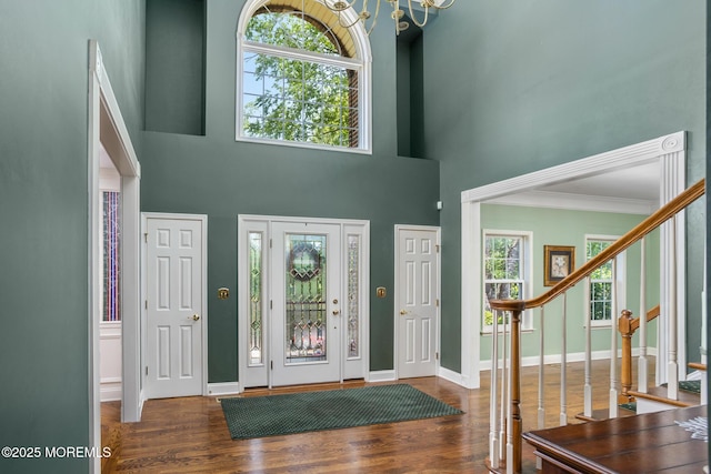 1 Yeger Dr, Upper Freehold, NJ 08501 - entryway featuring wood finished floors, a high ceiling, a chandelier, stairs, and baseboards