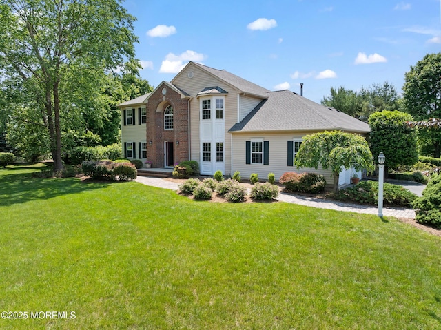 1 Yeger Dr, Upper Freehold, NJ 08501 - view of front of house featuring a front yard and brick siding