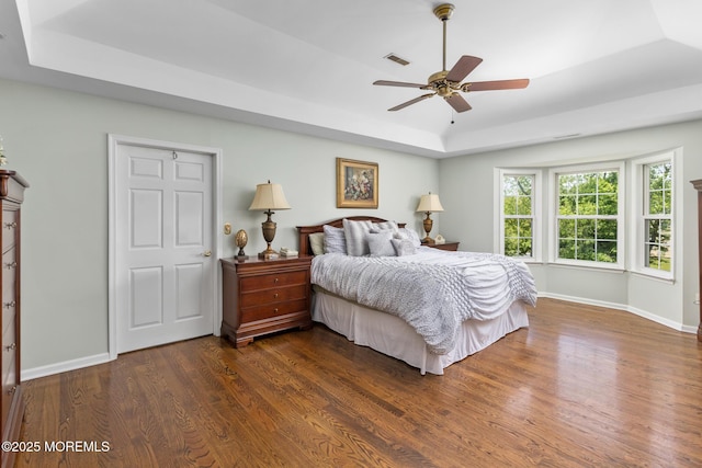 1 Yeger Dr, Upper Freehold, NJ 08501 - bedroom featuring a raised ceiling, dark wood-style flooring, baseboards, and ceiling fan