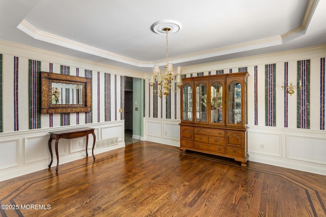 1 Yeger Dr, Upper Freehold, NJ 08501 - unfurnished room featuring a chandelier, ornamental molding, a raised ceiling, wood finished floors, and a decorative wall