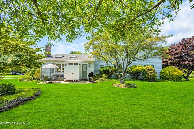 2146 Spruce Dr, Sea Girt, NJ 08750 - rear view of property with a patio area, a yard, and a chimney