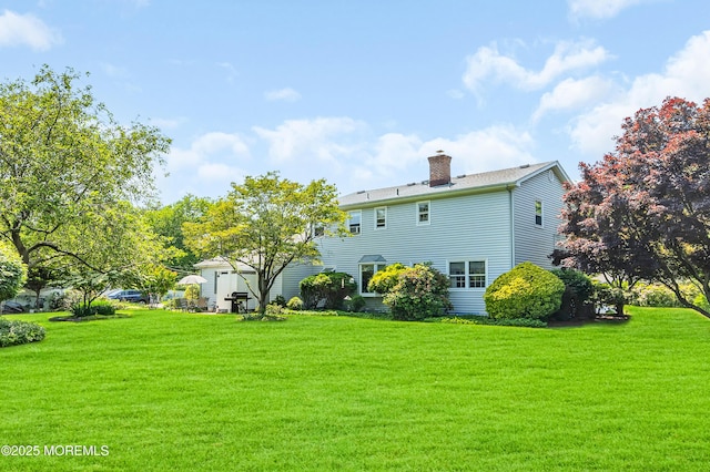 2146 Spruce Dr, Sea Girt, NJ 08750 - rear view of property with a yard and a chimney