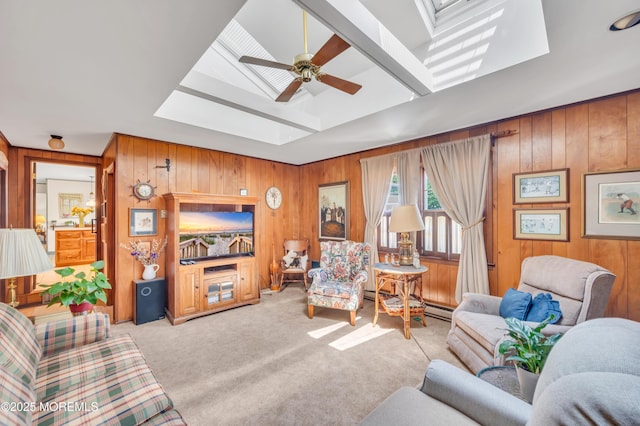 2146 Spruce Dr, Sea Girt, NJ 08750 - living room featuring wooden walls, light carpet, ceiling fan, and a skylight