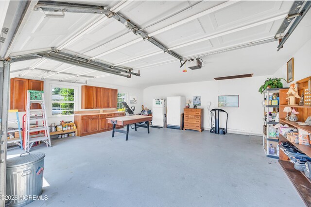 2146 Spruce Dr, Sea Girt, NJ 08750 - garage featuring freestanding refrigerator and a garage door opener