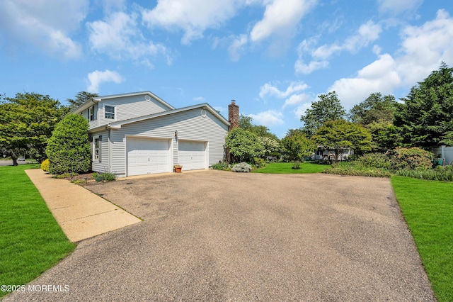 2146 Spruce Dr, Sea Girt, NJ 08750 - view of side of home featuring asphalt driveway, a yard, and an attached garage