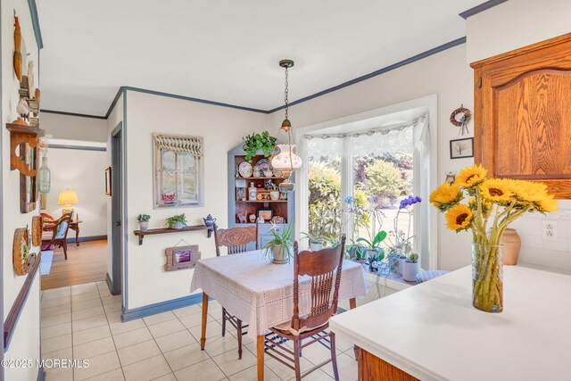 2146 Spruce Dr, Sea Girt, NJ 08750 - dining space featuring crown molding, baseboards, and light tile patterned flooring
