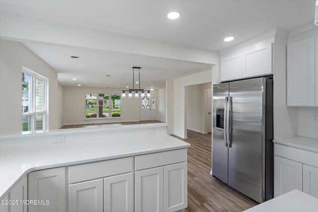 21 Turnbridge, Manchester, NJ 08759 - kitchen with stainless steel fridge, wood finished floors, white cabinets, light countertops, and recessed lighting
