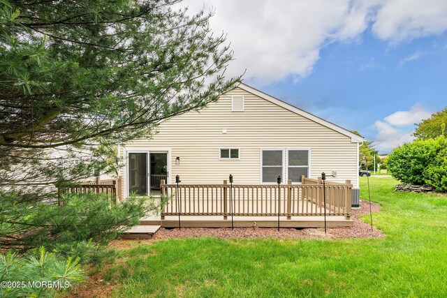 21 Turnbridge, Manchester, NJ 08759 - rear view of house featuring a lawn and a wooden deck