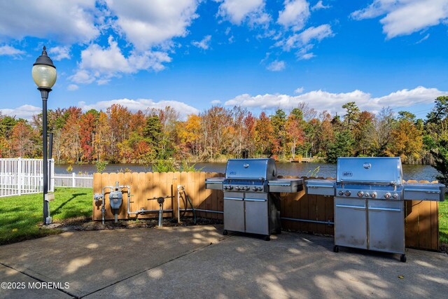 21 Turnbridge, Manchester, NJ 08759 - view of patio featuring a water view, area for grilling, and a forest view