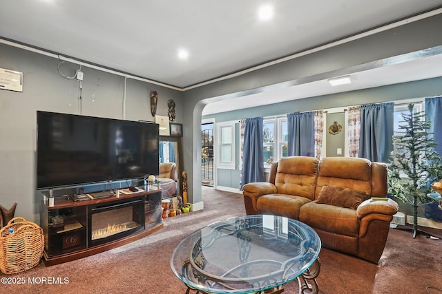 1952 Stratford Ave, Neptune Township, NJ 07753 - living room with carpet floors, arched walkways, plenty of natural light, recessed lighting, and a glass covered fireplace