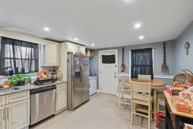 1952 Stratford Ave, Neptune Township, NJ 07753 - kitchen featuring appliances with stainless steel finishes, cream cabinetry, light stone counters, recessed lighting, and tasteful backsplash