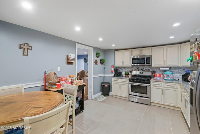 1952 Stratford Ave, Neptune Township, NJ 07753 - kitchen with appliances with stainless steel finishes, backsplash, recessed lighting, and light stone countertops