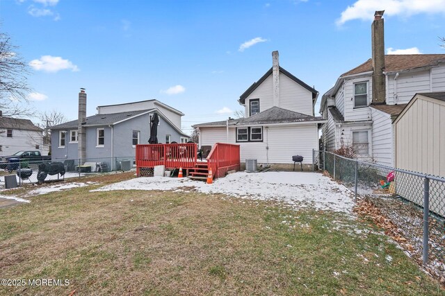 1952 Stratford Ave, Neptune Township, NJ 07753 - snow covered back of property featuring a deck and central AC unit