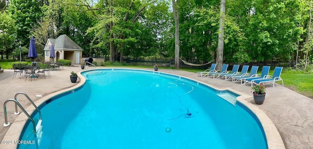 34 Bruns Rd, West Allenhurst, NJ 07711 - community pool featuring view of scattered trees, a patio area, and an outdoor structure