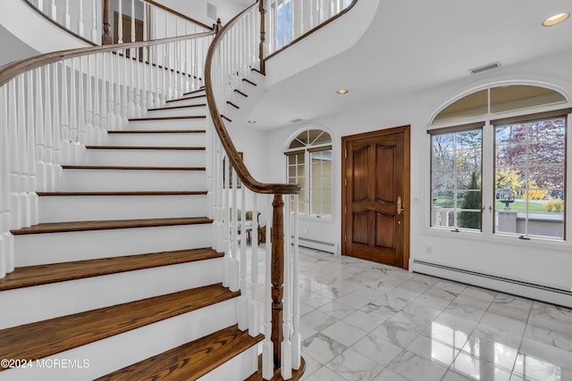 34 Bruns Rd, West Allenhurst, NJ 07711 - stairs with marble finish floors, recessed lighting, baseboard heating, and a towering ceiling