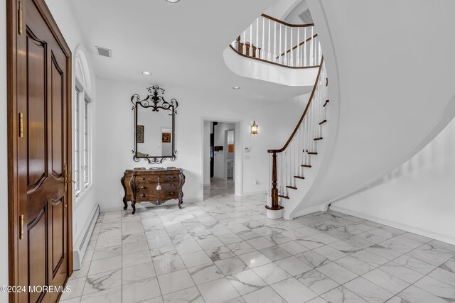 34 Bruns Rd, West Allenhurst, NJ 07711 - entryway featuring light marble finish flooring, stairs, baseboards, recessed lighting, and a baseboard radiator
